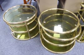 PAIR OF THREE TEAR, SWING PLATFORM, GOLD COLOURED TUBULAR STEEL AND SMOKED GLASS TABLES [2]