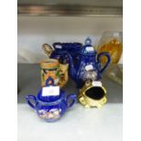ITALIAN BLUE AND GILT TWO HANDLE POTTERY VASE; A SIMILAR TEAPOT, SUCRIER AND COVER; POTTERY