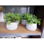 A SET OF FOUR SMALL COMPOSITION GREY COLOURED PLANTERS WITH FAUX PLANTS (4)