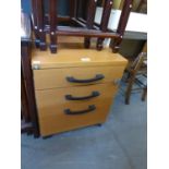 A NEST OF THREE BEECH EFFECT DRAWERS WITH METAL LINERS AND LOCKS