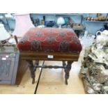 AN ADJUSTABLE VICTORIAN PIANO STOOL WITH FABRIC SEAT