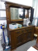 AN ARTS AND CRAFTS OAK MIRROR BACK SIDEBOARD , THE BASE HAVING TWO DRAWERS ABOVE TWO CUPBOARDS, (