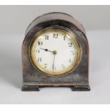 EARLY 20th CENTURY SMALL MANTEL CLOCK IN PLANISHED ELECTRO-PLATED CASE with white Arabic dial