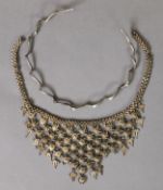 SILVER COLOURED METAL SPIRALLY TWISTED SPRUNG CHOKER NECKLACE AND A MIDDLE EASTERN SILVER COLOURED