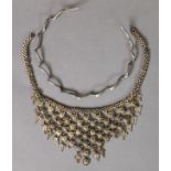 SILVER COLOURED METAL SPIRALLY TWISTED SPRUNG CHOKER NECKLACE AND A MIDDLE EASTERN SILVER COLOURED