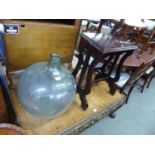 A LARGE GLASS CARBOY AND A SMALL LECTERN/WRITING SLOPE (2)