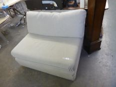 A SMALL TWO SEATER SETTEE, STONE COLOUR WITH LOOSE CUSHIONS