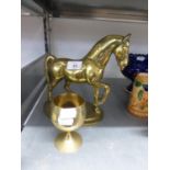 A HEAVY BRASS MODEL OF A HORSE, ON OVAL BASE AND AN ELECTROPLATE GOBLET (2)
