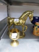 A HEAVY BRASS MODEL OF A HORSE, ON OVAL BASE AND AN ELECTROPLATE GOBLET (2)