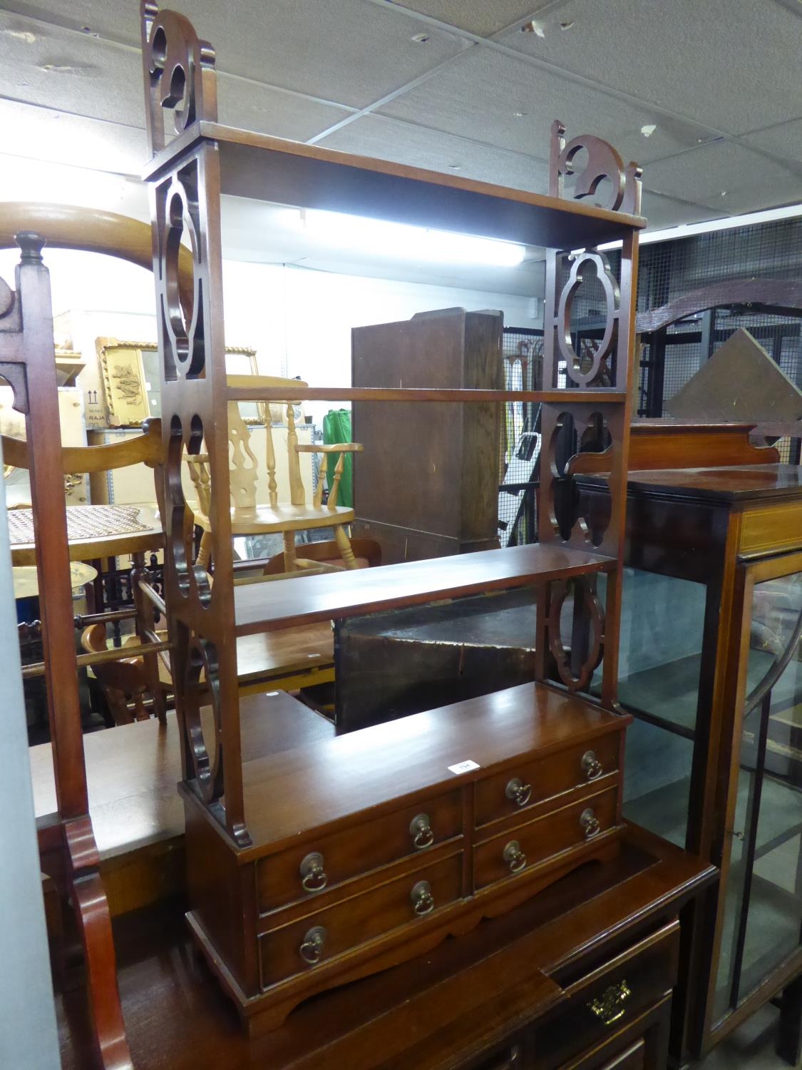 A SET OF MAHOGANY OPEN SHELVES, HAVING FOUR SMALL DRAWERS TO BASE