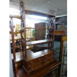 A SET OF MAHOGANY OPEN SHELVES, HAVING FOUR SMALL DRAWERS TO BASE