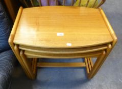 A NEST OF THREE VINTAGE TEAK COFFEE TABLES