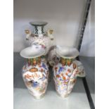 A PAIR OF MODERN CHINESE PORCELAIN OVULAR VASES AND A PAIR OF PORCELAIN VASES WITH CARYATID