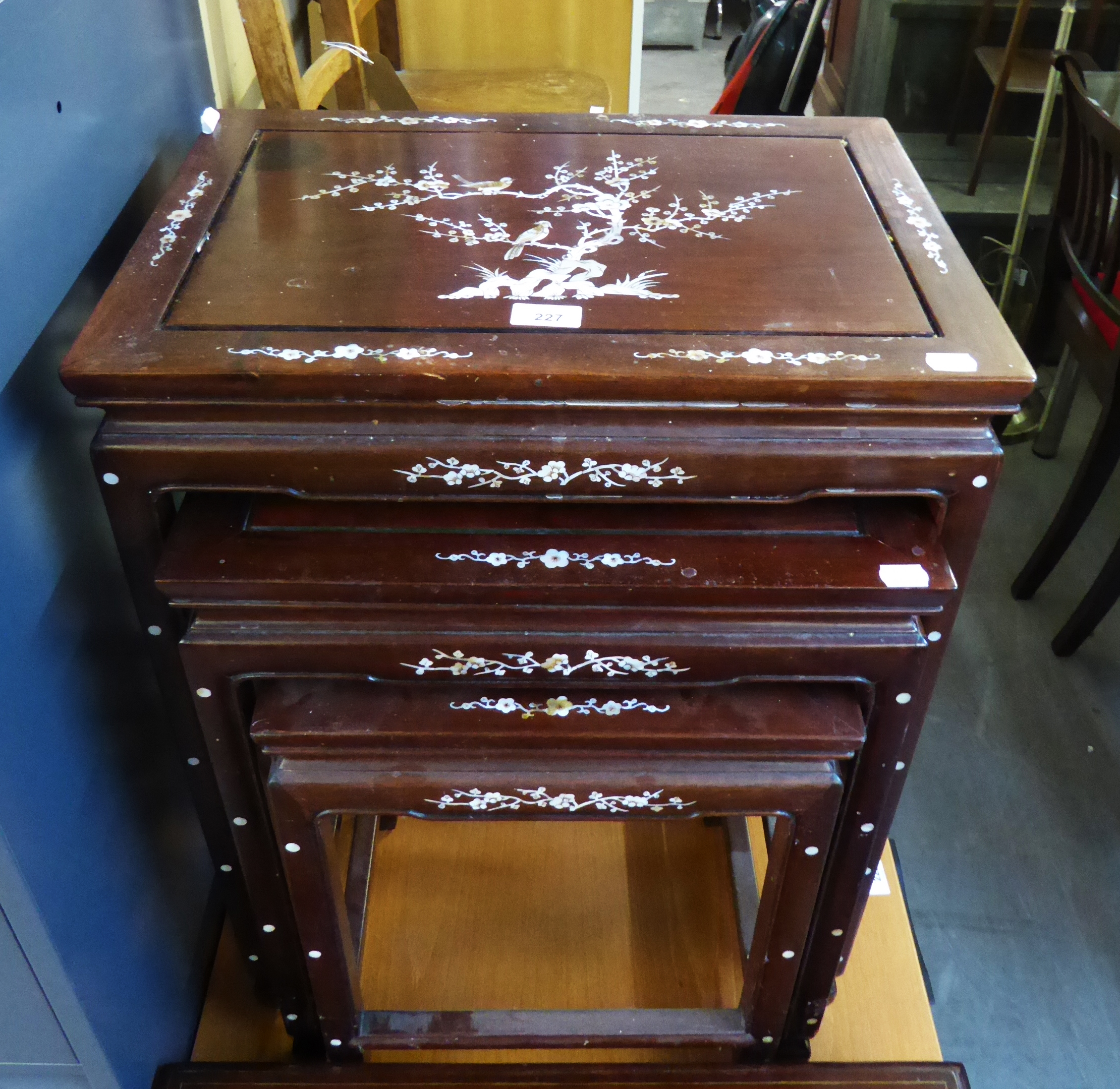 A NEST OF THREE CHINESE HARDWOOD OBLONG COFFEE TABLES, WITH BONE INLAY