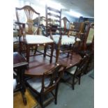 A REPRODUCTION MAHOGANY TWIN PILLAR DINING TABLE AND SIX CHAIRS (IN. TWO CARVERS) BY RACKSTRAW