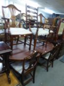 A REPRODUCTION MAHOGANY TWIN PILLAR DINING TABLE AND SIX CHAIRS (IN. TWO CARVERS) BY RACKSTRAW