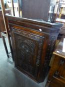 GEORGE III OAK CORNER CABINET WITH MACCLESFIELD CARVING