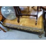 A MODERN LARGE SQUARE WALNUT COFFEE TABLE WITH CARVED FRIEZE AND LEGS