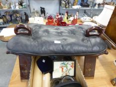 A MIDDLE EASTERN TEAK SADDLE PATTERN STOOL WITH BRASS INLAY AND BUTTONED LEATHER CUSHION