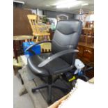 AN EXECUTIVE REVOLVING OFFICE ARMCHAIR, IN BLACK LEATHER