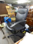 AN EXECUTIVE REVOLVING OFFICE ARMCHAIR, IN BLACK LEATHER