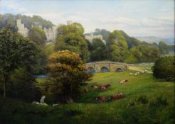 GEORGE WIMPENNY (EARLY TWENTIETH CENTURY) OIL PAINTING View of Haddon Hall with stone bridge, cattle