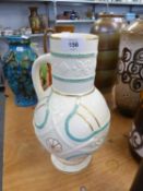 VICTORIAN MOULDED POTTERY JUG, WHITE GLAZED AND HEIGHTENED IN PALE BLUE AND GILT, MODELLED IN LOW