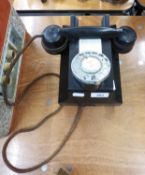 A VINTAGE WALL MOUNTED ROTARY DIAL TELEPHONE