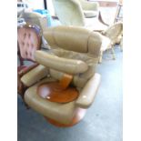 A BROWN LEATHER STRESSLESS STYLE ARMCHAIR AND A MATCHING FOOTSTOOL (2)