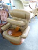A BROWN LEATHER STRESSLESS STYLE ARMCHAIR AND A MATCHING FOOTSTOOL (2)