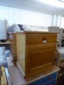 A PAIR OF PINE BEDSIDE PEDESTALS WITH A DRAWER OVER A FALL FRONT COMPARTMENT (2)