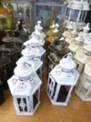 SIX WHITE PAINTED CANDLE LANTERNS, LACKING GLASS, PLUS TWO GOLD COLOURED EXAMPLES, AND TWO IN