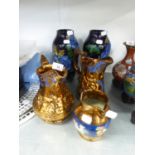 TWO COPPER LUSTRE JUGS, ONE EMBOSSED WITH BALLET DANCERS, ONE WITH DEER, 8” HIGH; ANOTHER SMALLER