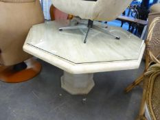 A GOOD QUALITY CULTURED MARBLE OCTAGONAL SHAPED DINING TABLE, HAVING GLASS PROTECTOR, RAISED ON AN