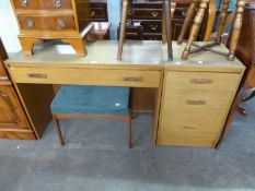 A MID-CENTURY TEAK DRESSING TABLE WITH ONE LONG DRAWER ON END PANEL SUPPORTS; THE REMOTE PEDESTAL OF