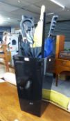 A BLACK PLASTIC SQUARE TAPERING PLANTER AND A QUANTITY OF UMBRELLA'S