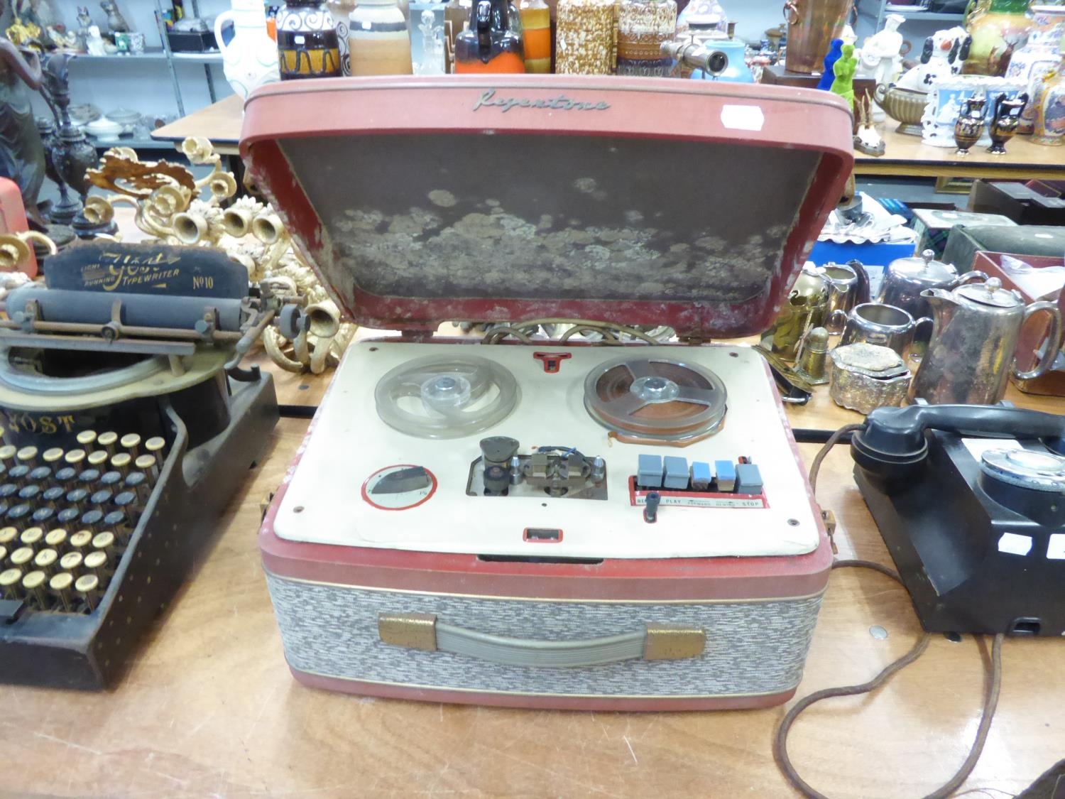 A PORTABLE ELECTRIC RECORD PLAYER