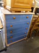 A PAIR OF PINE AND BLUE FRONTED CHESTS OF TWO SHORT AND FOUR LONG DRAWERS