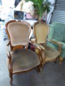 TWO SIMILAR BALLOON BACK NURSING OPEN ARMCHAIRS, WITH SCROLL ARMS, RAISED ON FRONT CABRIOLE LEGS,