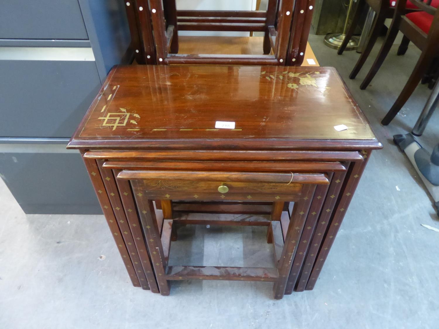 A NEST OF FOUR INLAID MAHOGANY OBLONG COFFEE TABLES