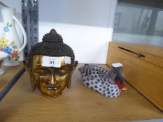 A CARVED AND GILT WOOD HEAD OF THE BUDDHA, 1 ¾” HIGH AND A COLD PAINTED WOOD DECOY DUCK (2)