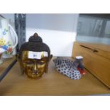 A CARVED AND GILT WOOD HEAD OF THE BUDDHA, 1 ¾” HIGH AND A COLD PAINTED WOOD DECOY DUCK (2)