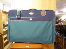 REVELATION GREEN CANVAS LARGE SUITCASE WITH INTERIOR FITTINGS FOR TWO SUITS, BROWN HIDE TRIM AND TWO