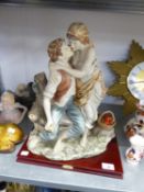 LA ANIMA COLLECTION’, LARGE RESIN GROUP, YOUNG COUPLE EMBRACING, ON MAHOGANY BASE, 16” HIGH