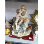 LA ANIMA COLLECTION’, LARGE RESIN GROUP, YOUNG COUPLE EMBRACING, ON MAHOGANY BASE, 16” HIGH