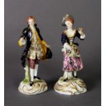 TWO DERBY FIGURE GROUPS, one as a gentleman in frock coat, the other a lady with flowers in her