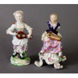 19TH CENTURY DERBY FIGURE GROUP OF A WOMAN IN HEADSCARF WITH A HURDY-GURDY, on scrolling