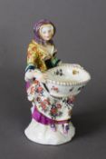 EARLY 19TH CENTURY MEISSEN FIGURE GROUP OF SEATED LADY WITH BASKET, with underglaze marks to the