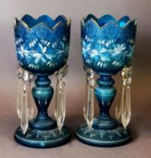 A PAIR OF EDWARD VII FROSTED BLUE GLASS TABLE LUSTRES, one with significant repair, 11 ½” (29 cm)