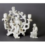 19TH CENTURY PARIAN FIGURAL CANDELABRA AS VENUS AND CUPID TO A FOLIATE BACKDROP ON ROCOCO BASE,